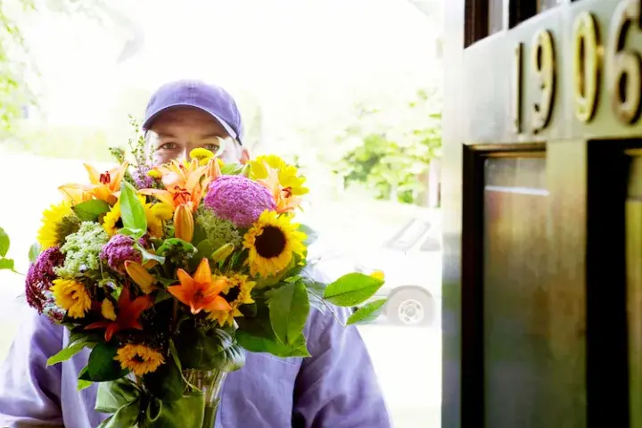 Bankruptcy man holding flowers