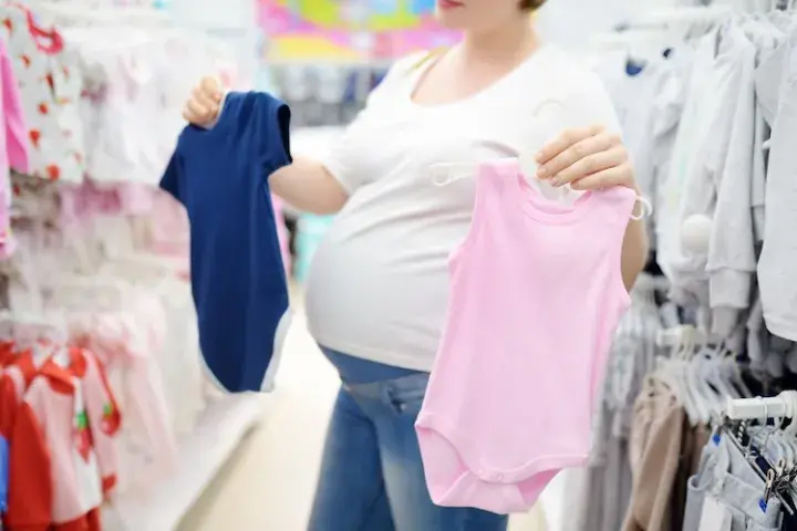 Pregnant woman shopping for clothes